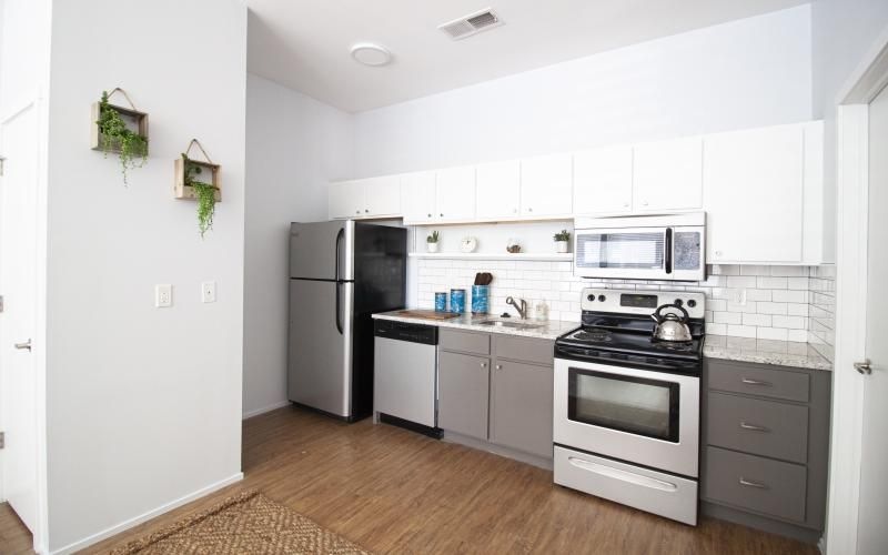 a kitchen with white cabinets